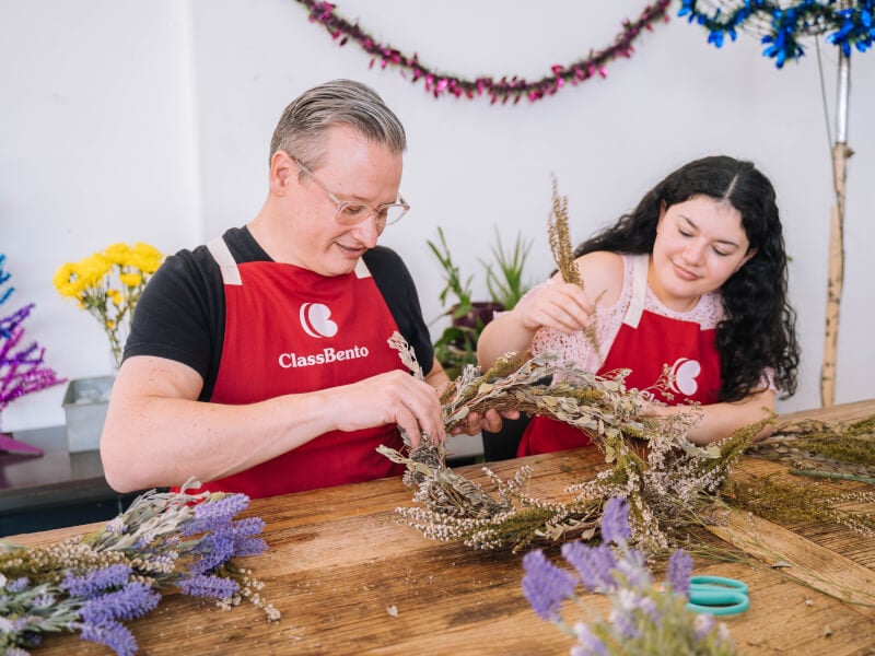 People making a Christmas wreath