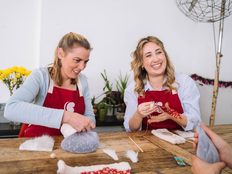 Women enjoying a sewing class