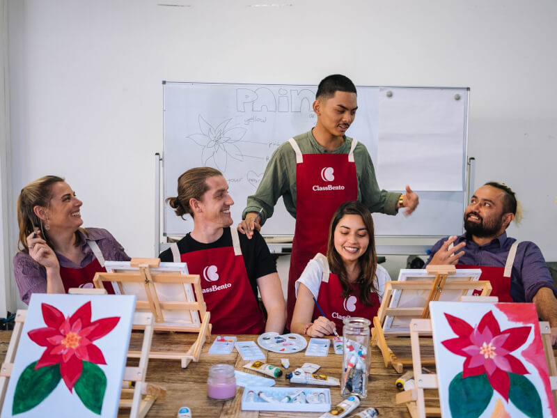 People enjoying a Christmas painting class
