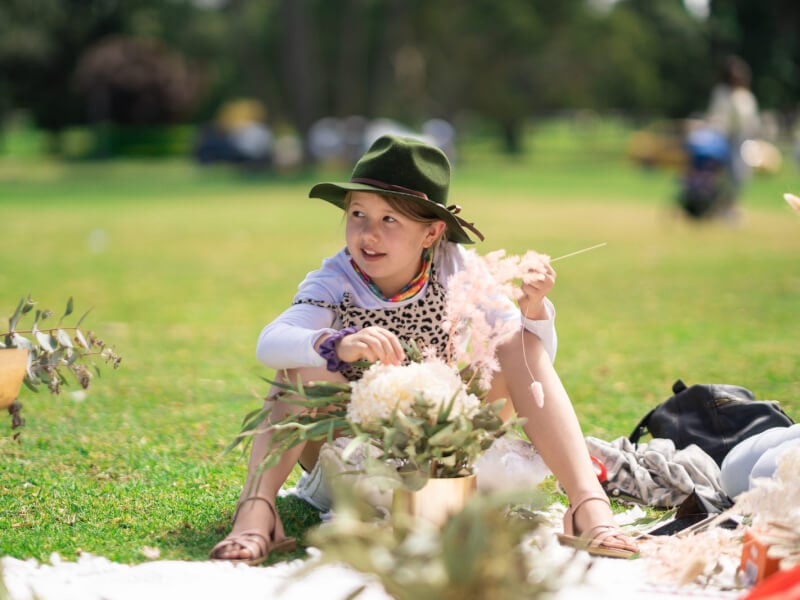 child smiling at dried flower class