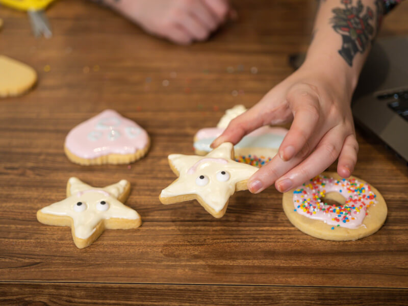 Hand picking up a star-shaped cookie