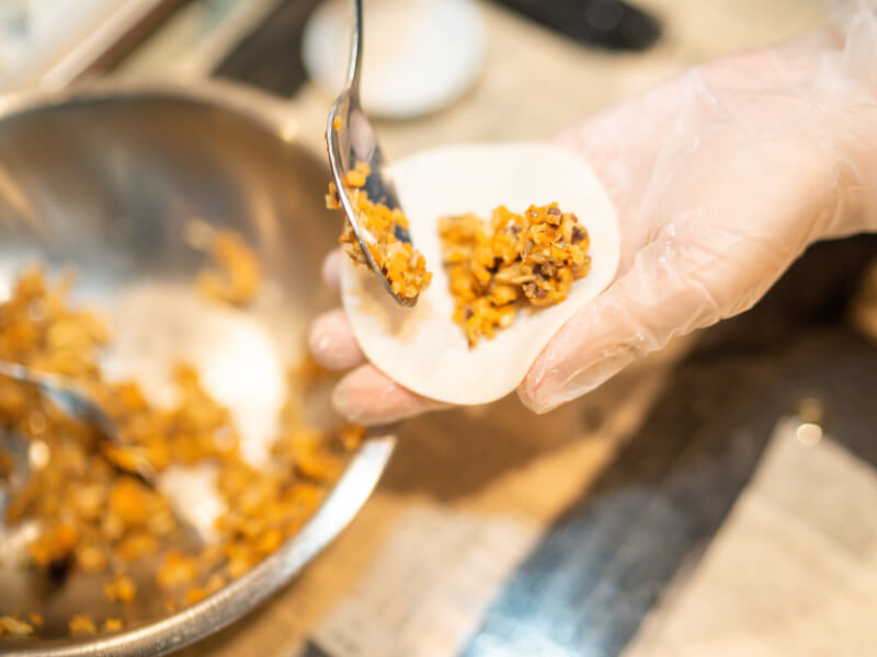 folding filling into dumpling