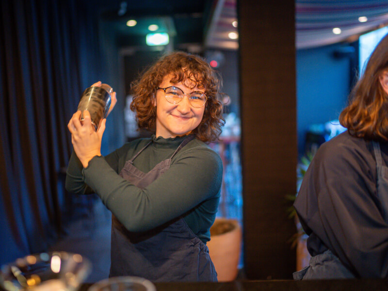 woman shaking cocktails