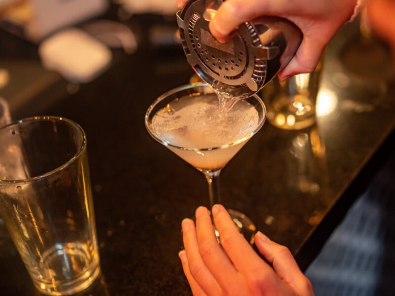 pouring martini cocktail