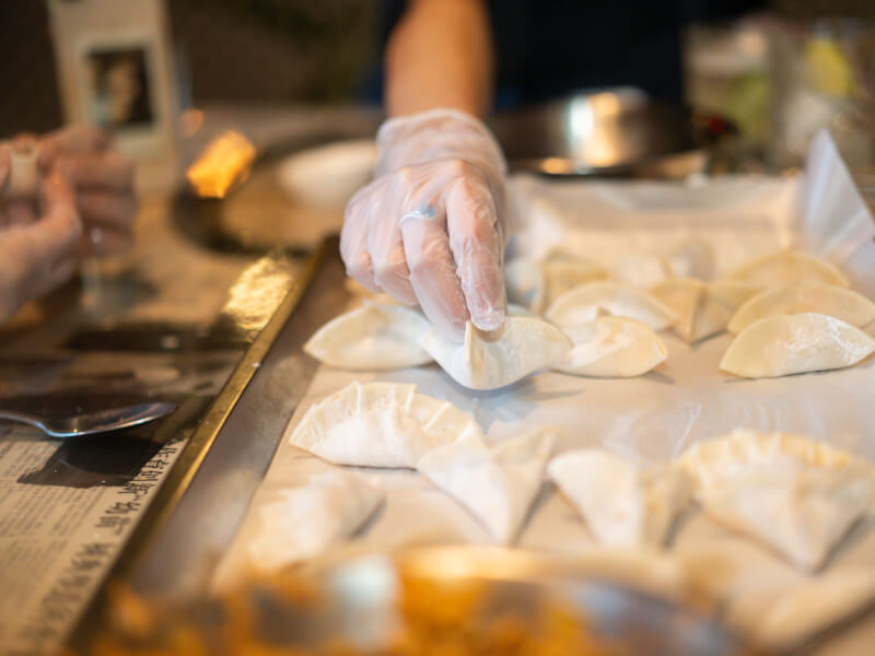 folding dumplings at Honkas Bar + Eats