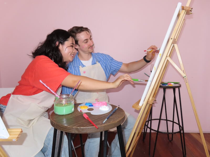 Couple painting together