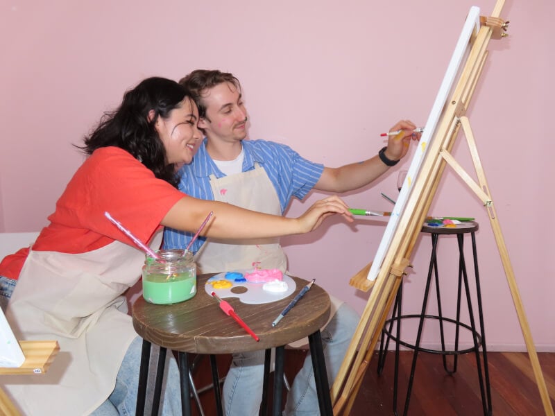 Couple painting together