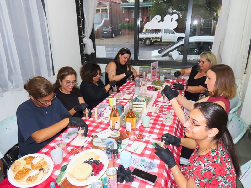 Group of women making resin trinket trays