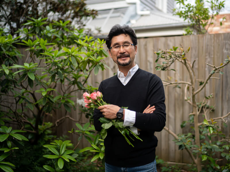 Ikebana teacher Shoso Shimbo posing with flowers