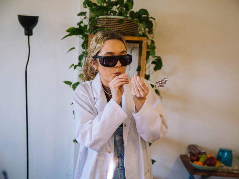 Young woman learning how to blow glass in Melbourne