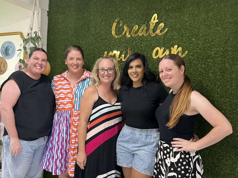 group of women at a charm and cocktail class