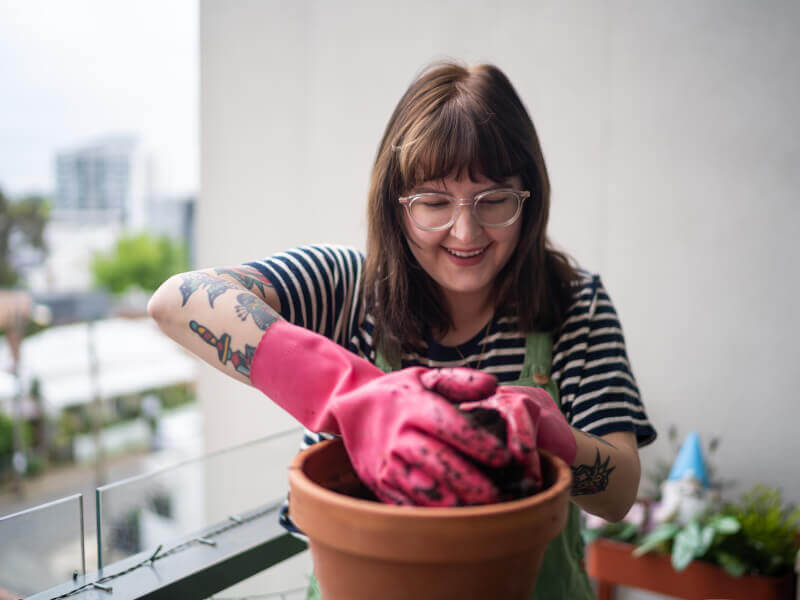 A woman making a Kokedama