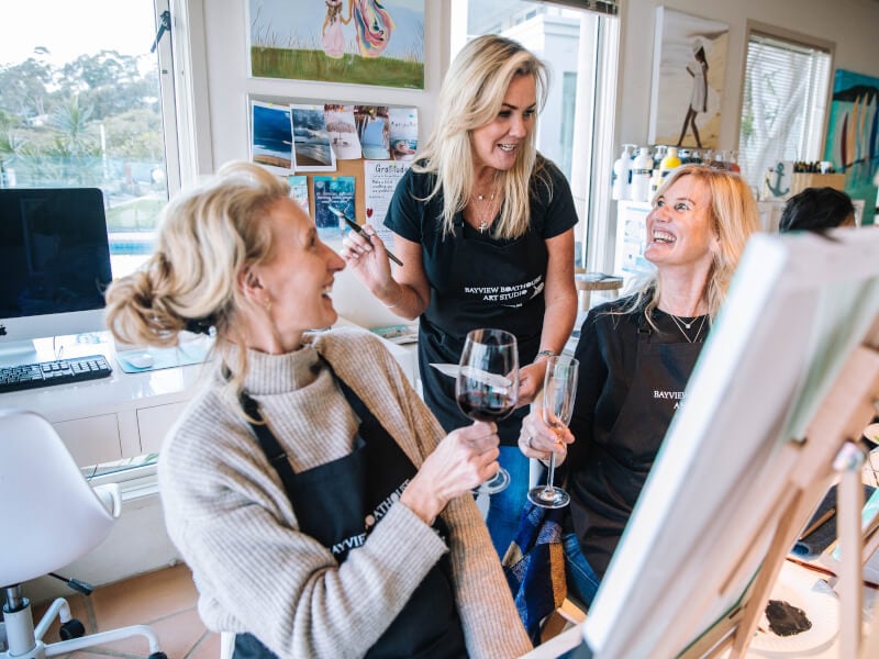 Women having fun and a paint and sip