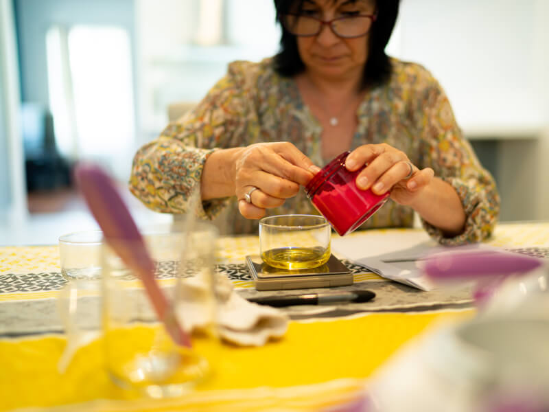 woman making natural skincare products