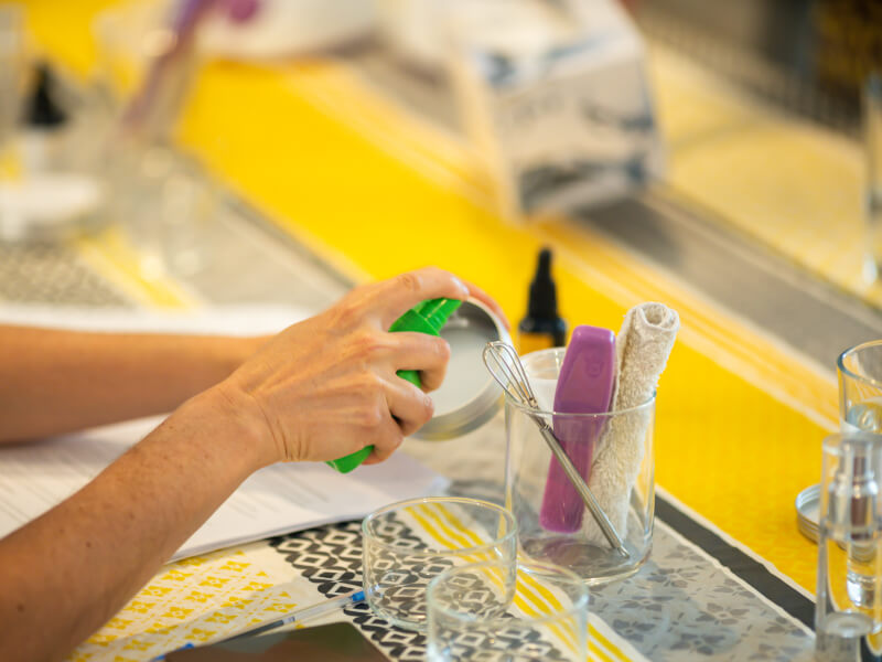 spraying skincare container
