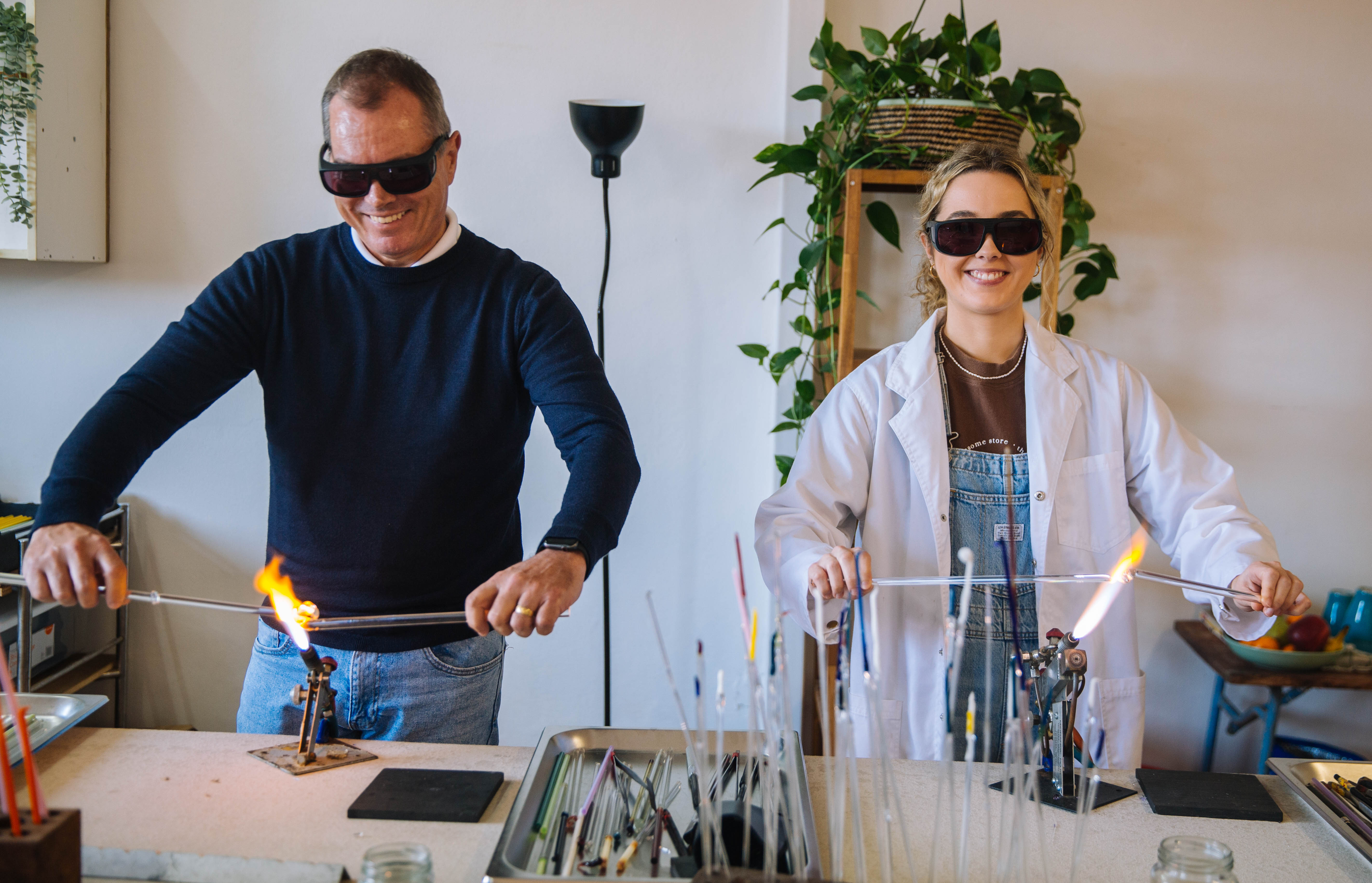 Father and daughter doing a glassblowing class