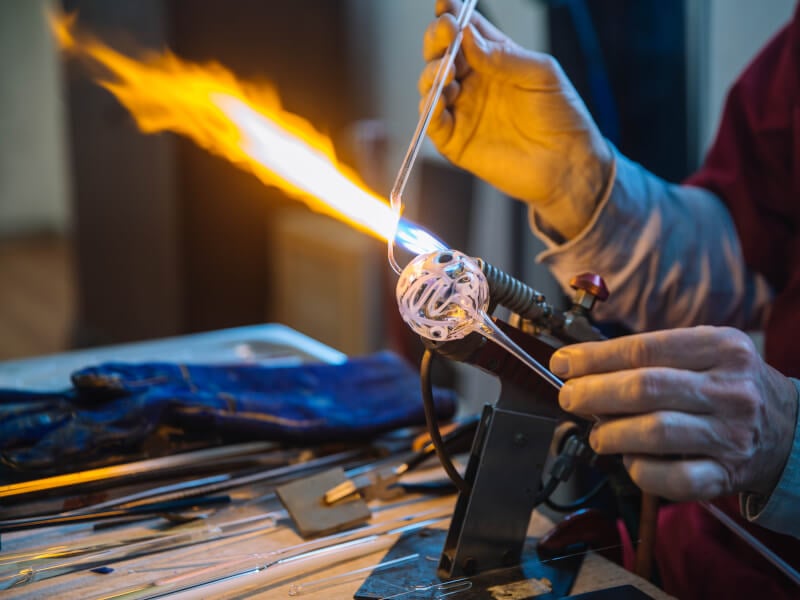 Close-up of man glassblowing
