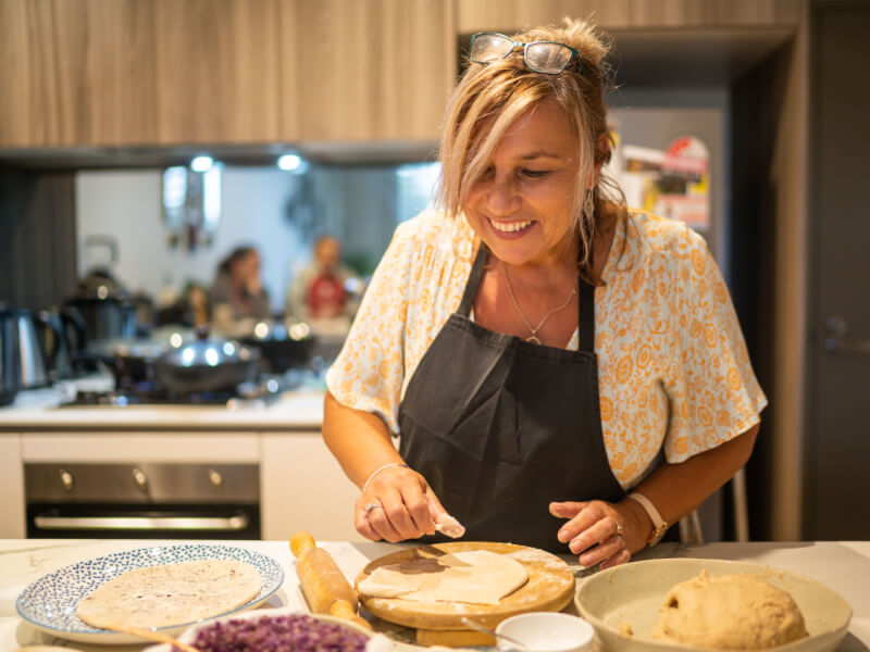 woman smiling at cooking class