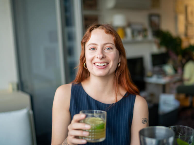 woman smiling with DIY mojito