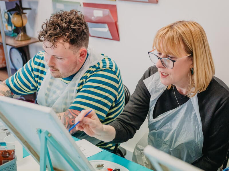Mother and son at a painting class