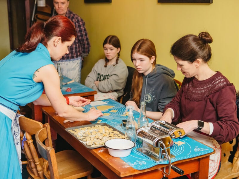 Mum and two daughters at a pasta-making class