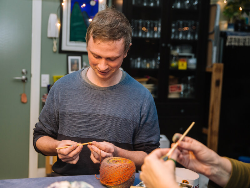 Man crocheting