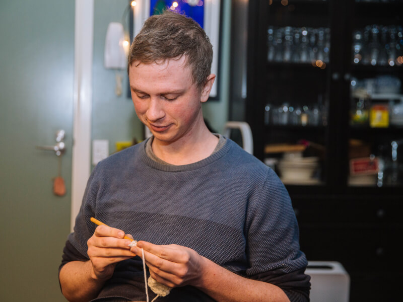 Man crocheting