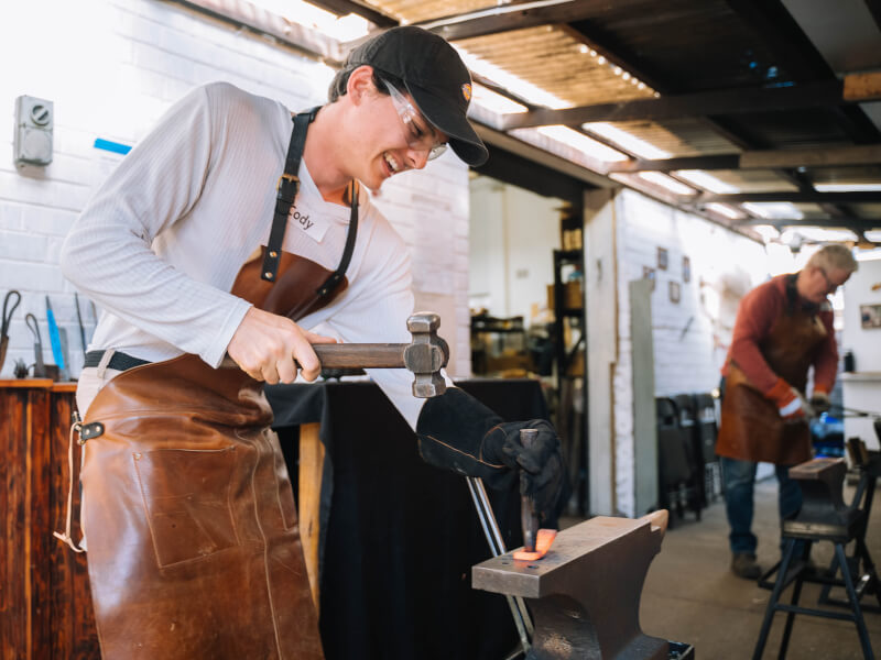 Man hammering hot metal