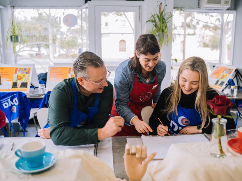 Teacher and students at a drawing class