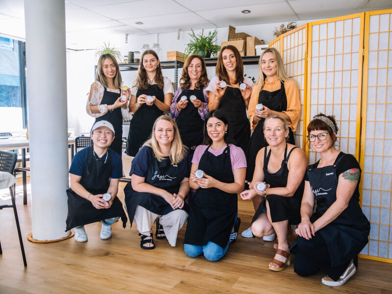 Women showing off their handmade skincare products