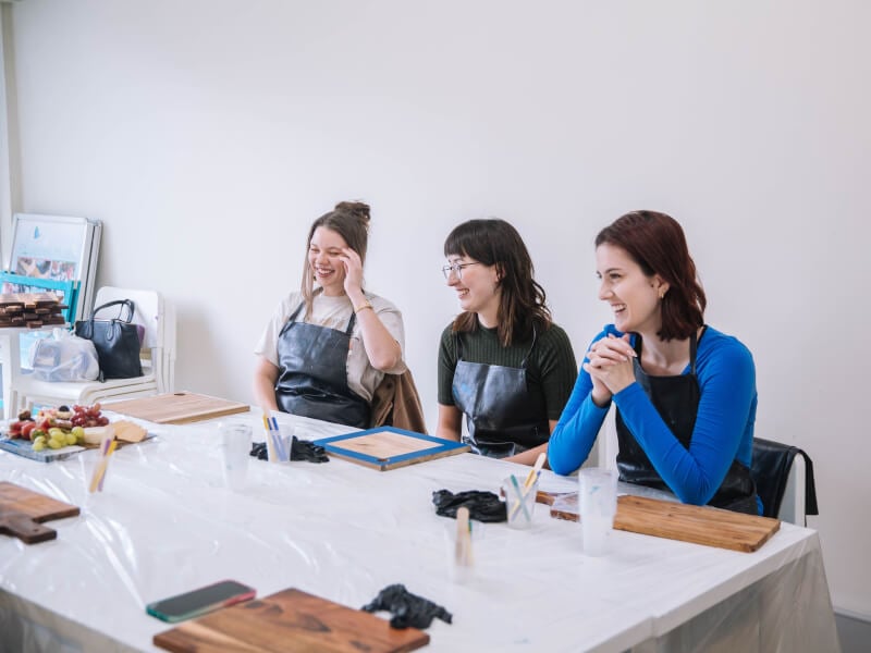 Women enjoying a resin art class