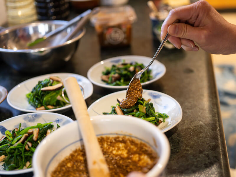 adding finishing touches to Japanese food