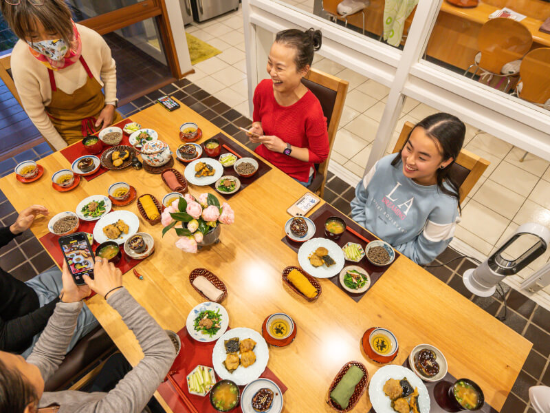 Cooking students enjoying their freshly made meal at a vegan Melbourne cooking class