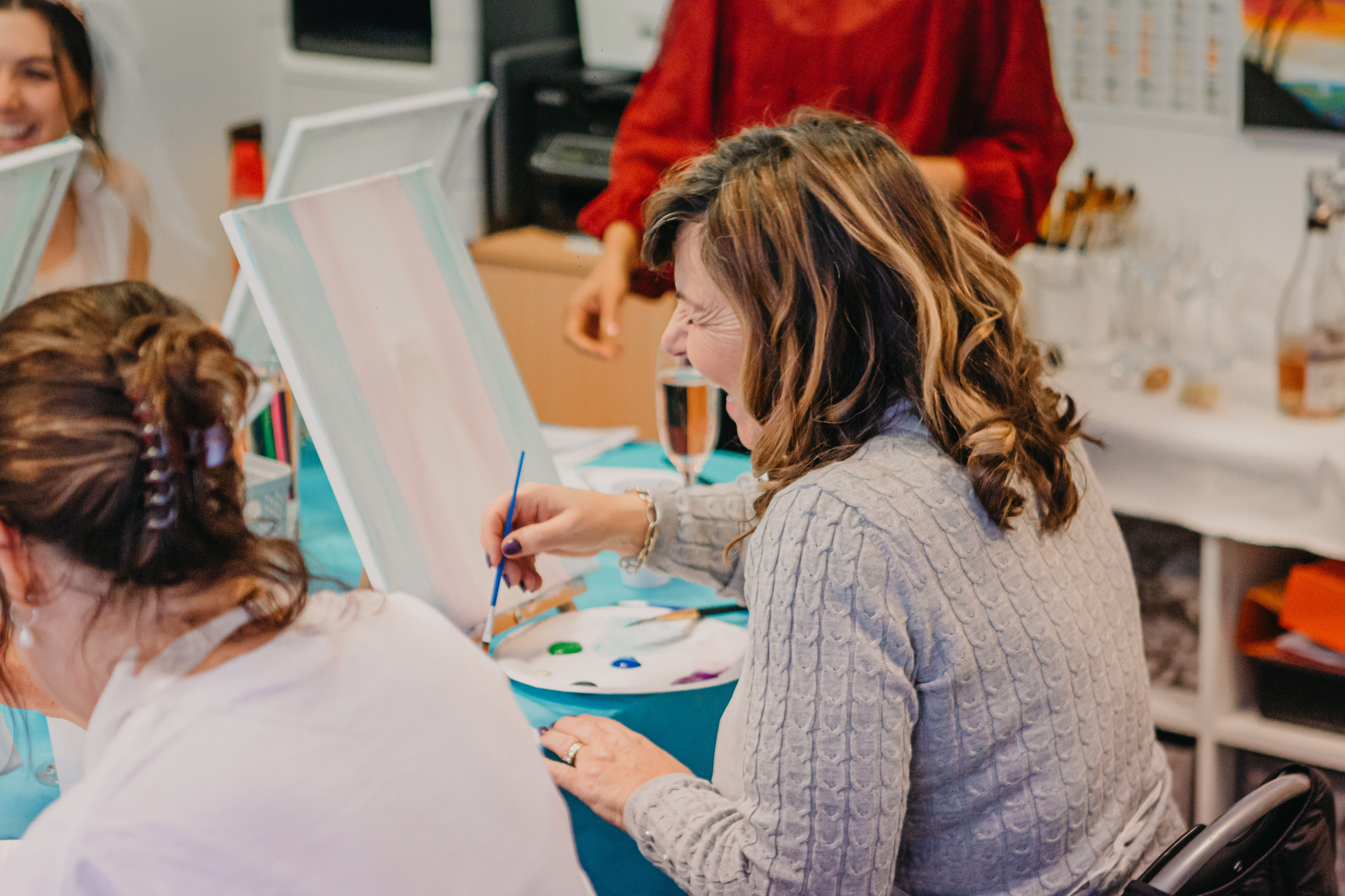Woman enjoying her painting class