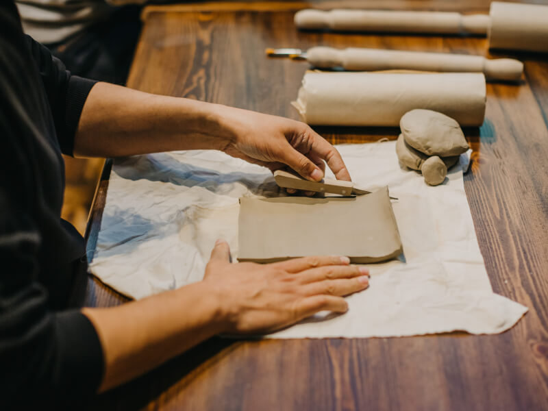 Man cutting clay