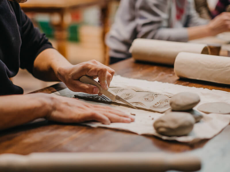 Man cutting clay