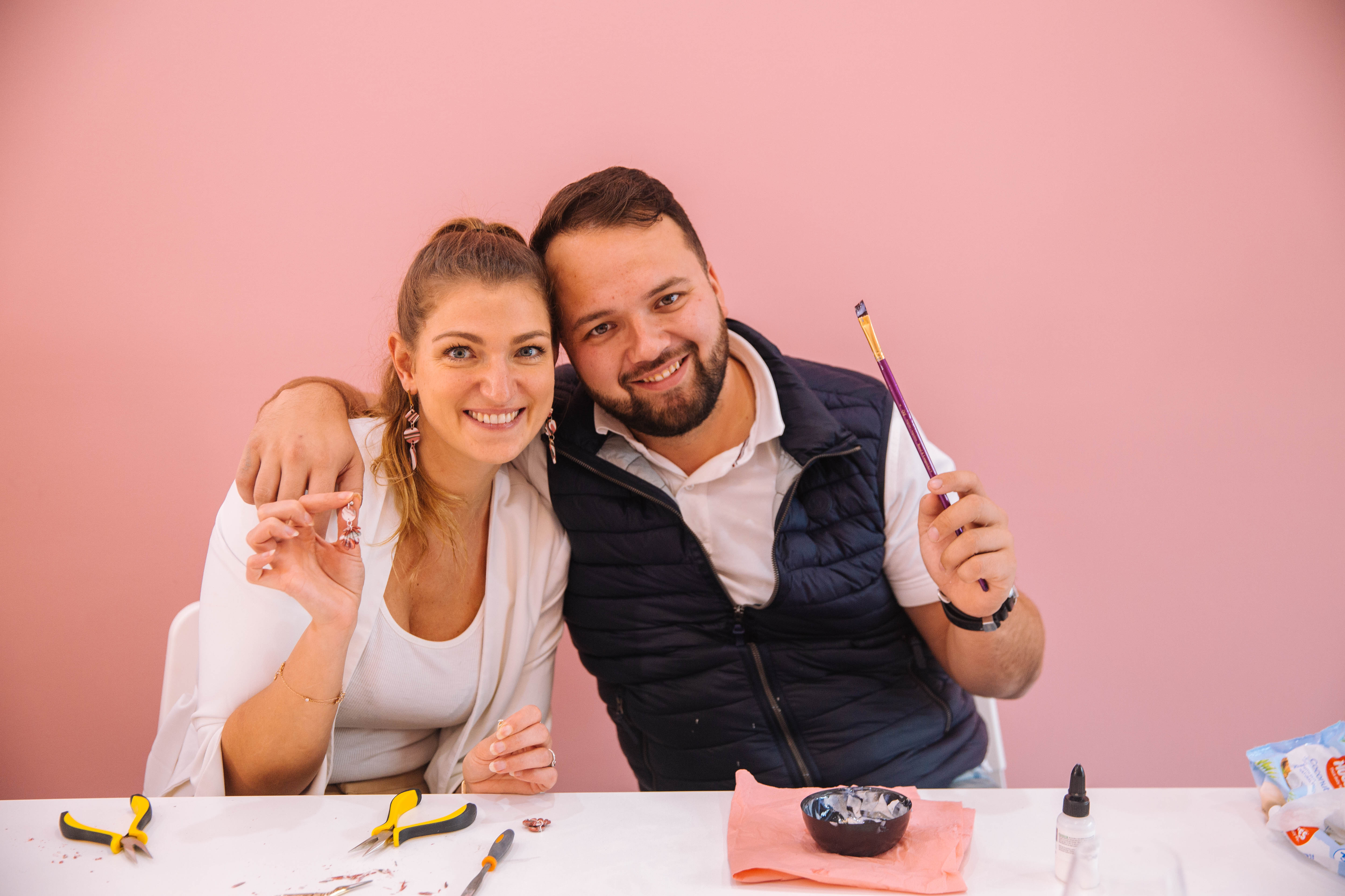 People posing together at a jewellery making class