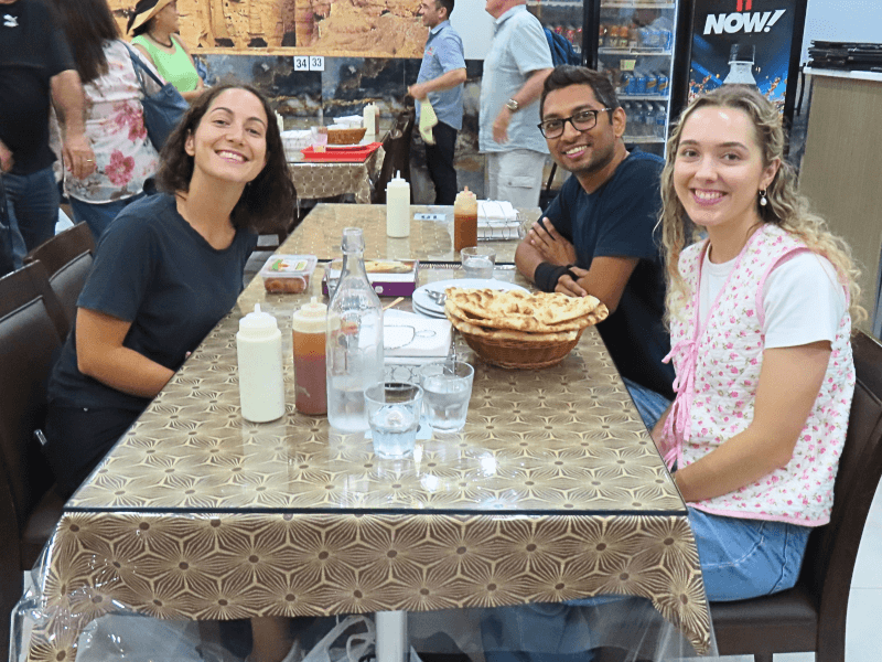 People sitting down at a Middle Eastern food walking tour