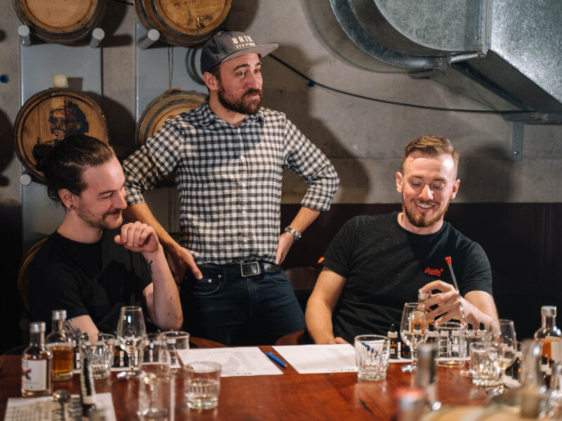 Teacher and students at a rum spicing class