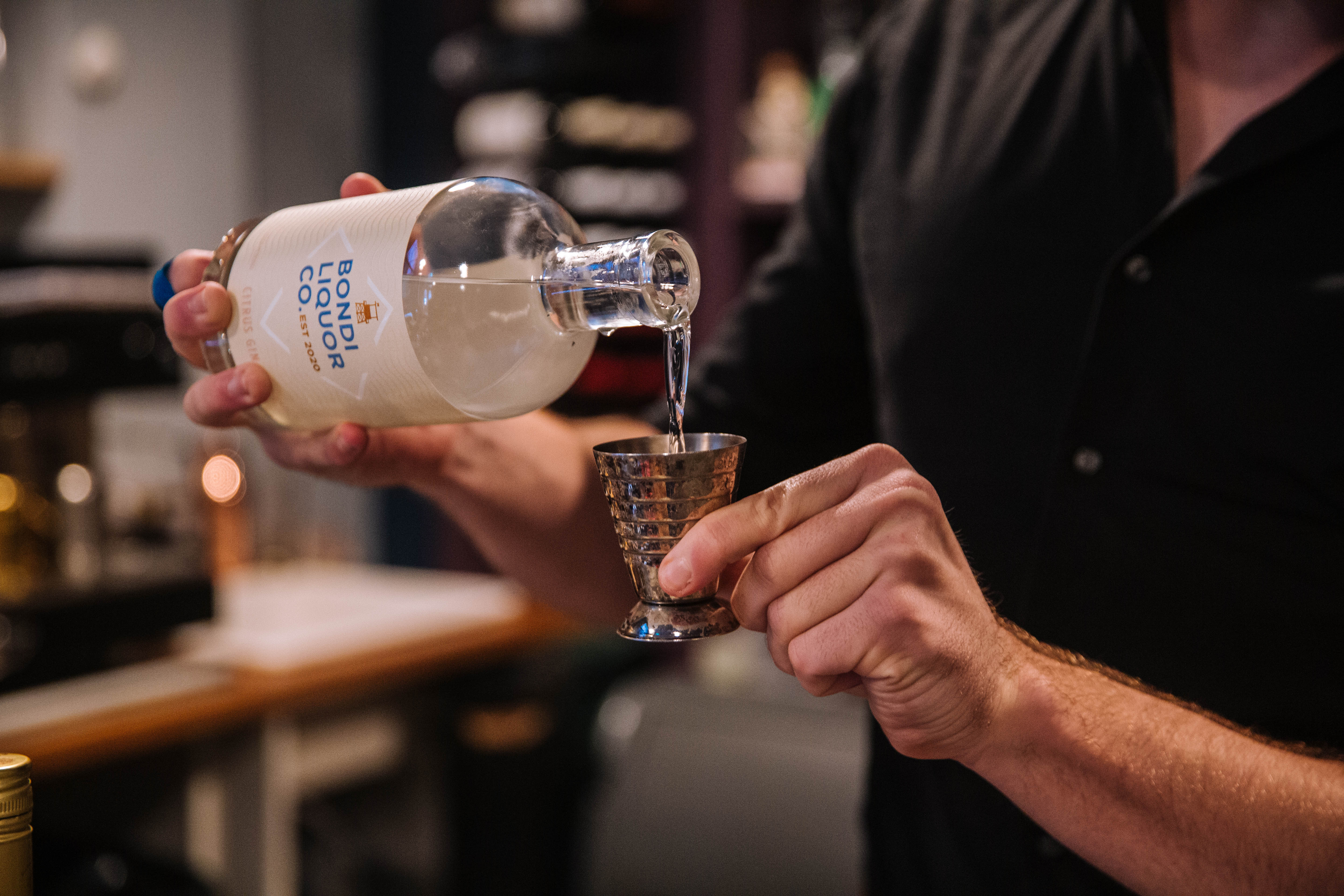 Gin tasting - man pouring gin