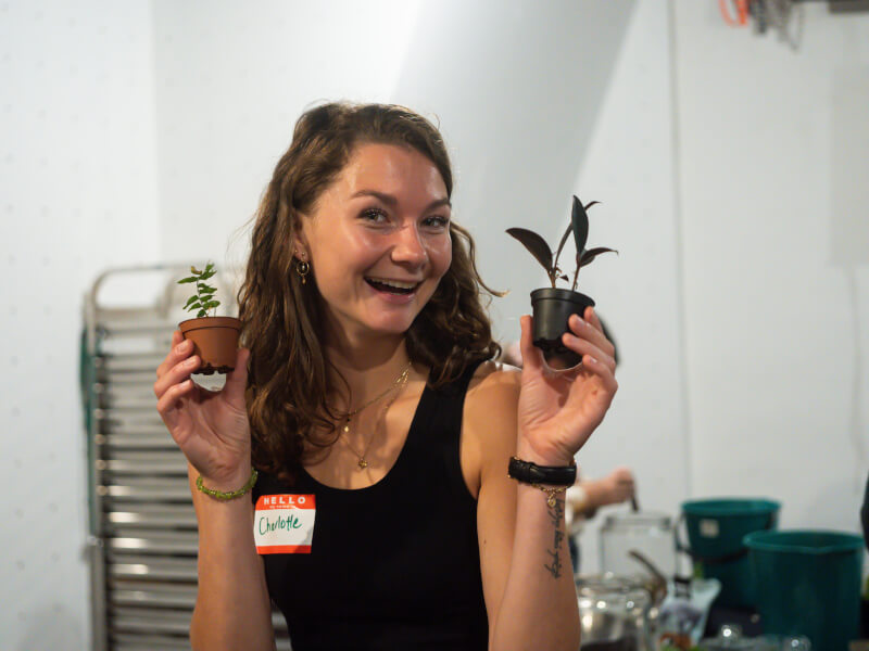 woman smiling with terrarium plants