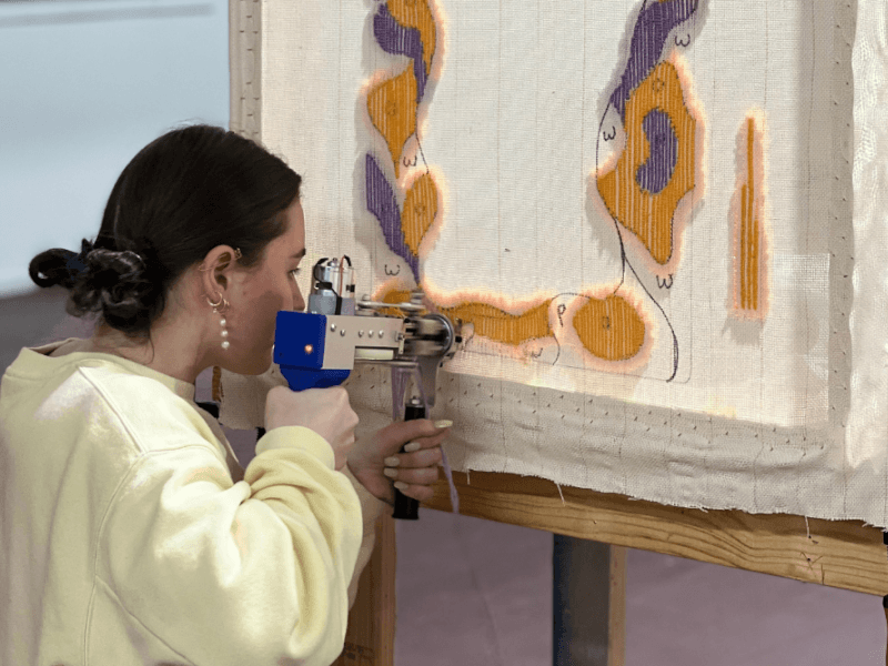 Girl tufting a mirror frame