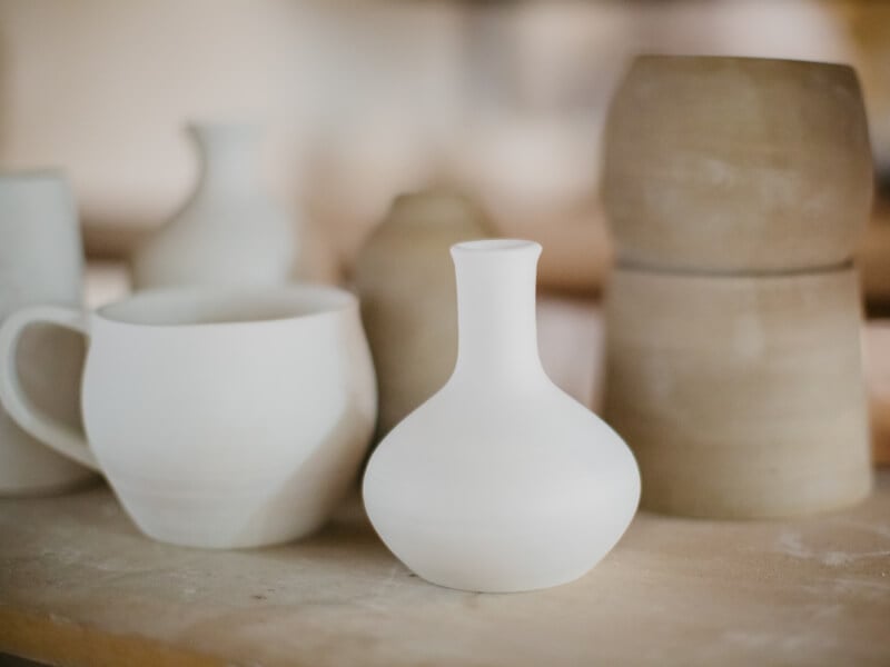 Unglazed ceramic objects on a shelf