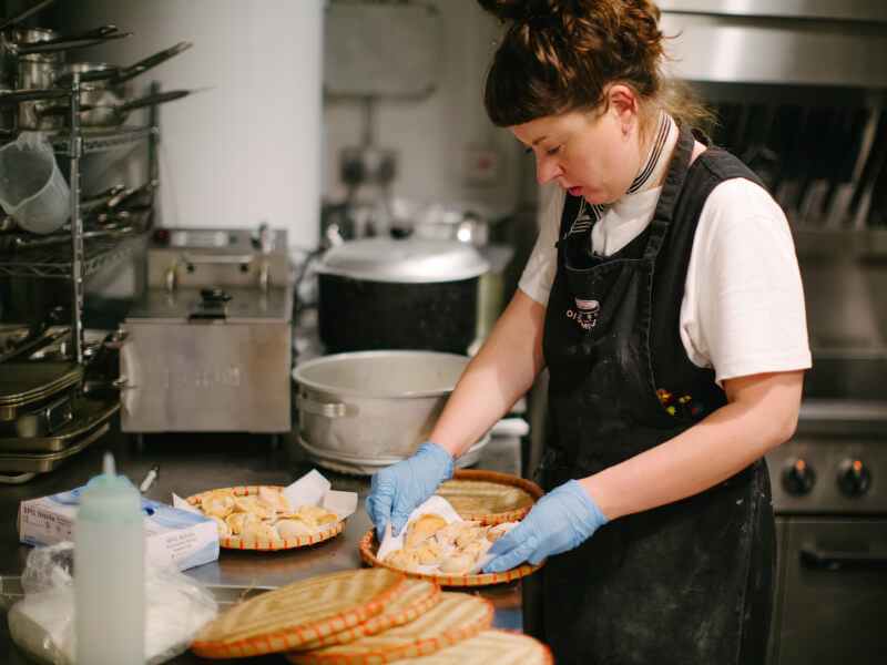 A woman prepares dumplings at a Melbourne cooking class