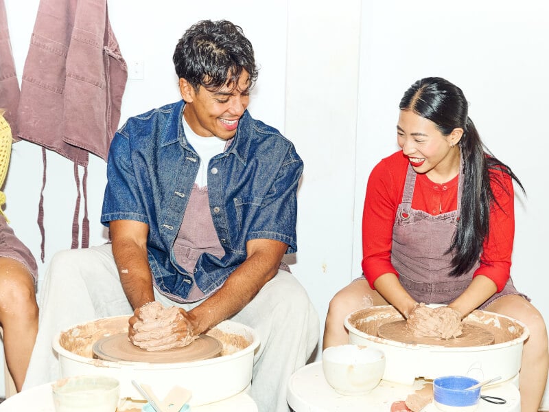 People enjoying a wheel throwing class