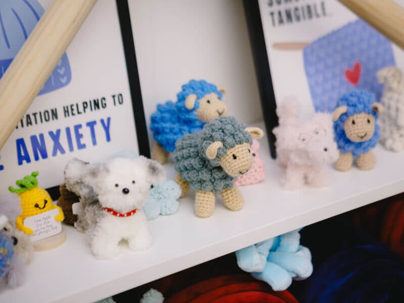 A shelf of amigurumi