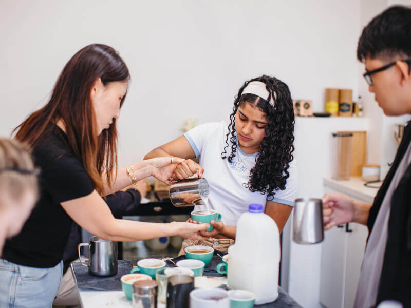 Women making coffee at barista class in Melbourne