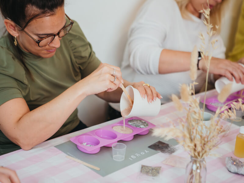 Two women making soap at a beauty and fragrance class