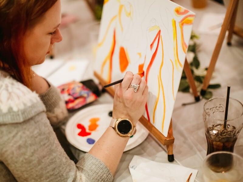 Woman painting at art class