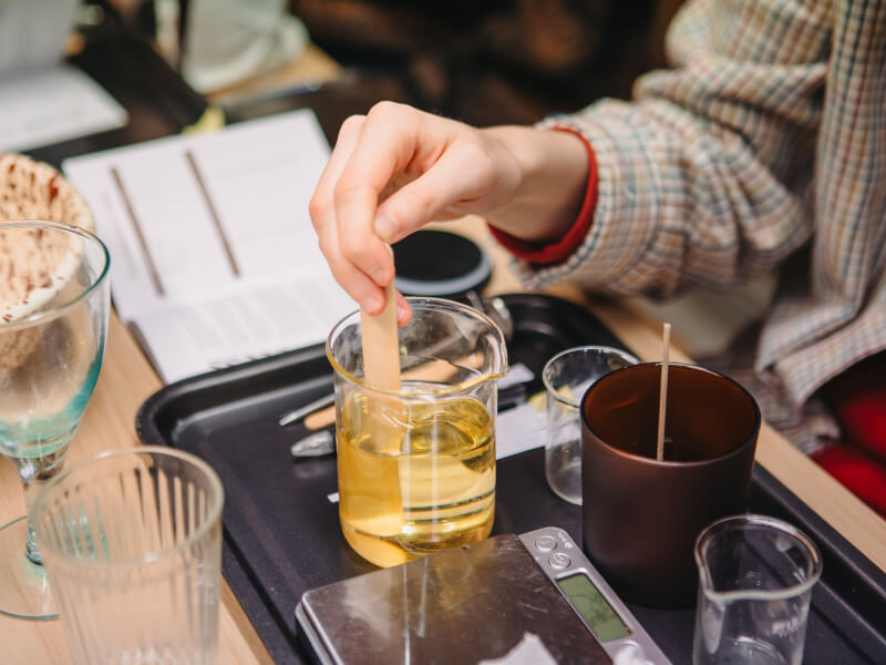 Person mixing candle wax